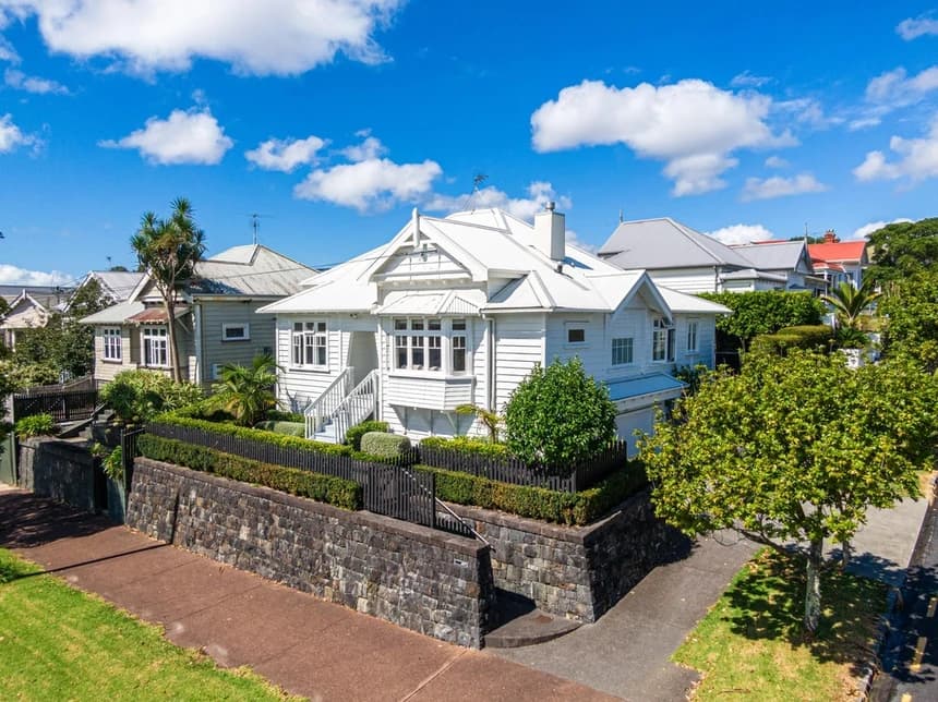 Grey Lynn streetscape with character villas, mature pohutukawa trees and colourful gardens